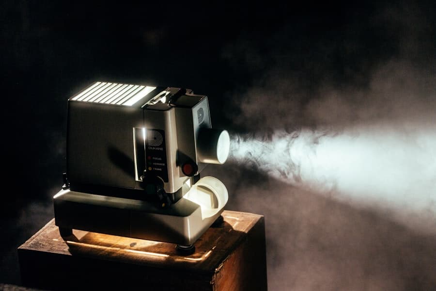 A vintage film projector casting a bright beam of light through smoke in a dark room