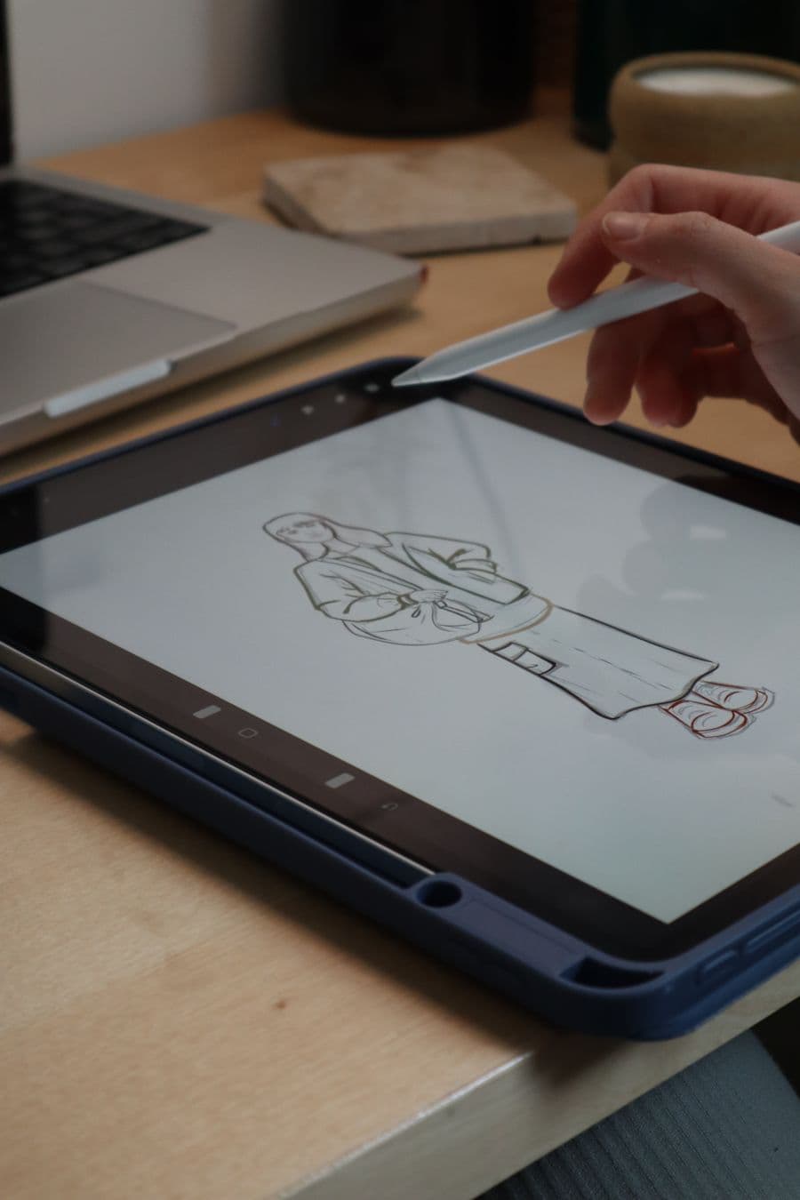 Close-up of a stylus pen sketching on a digital drawing tablet